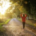 woman walking on pathway during daytime